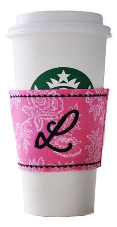 a coffee cup sleeve with a monogrammed letter e on the front and bottom