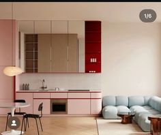 a living room filled with furniture next to a kitchen and dining area in front of a window