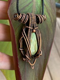 This Beautiful Healing Egyptian God Relic pendant was hand crafted by me with love. Made with 99% copper that has been oxidized to give it a vintage appearance. It features a beautifully flashy Yellow,Gold, and green Labradorite. Lots of yellow/Gold flash! I can do custom orders on all of the designs in my shop. If you would like a different stone in a particular setting/design just send me a message. All my pendants come with a simple 20 inch black corded necklace. Green Labradorite, Corded Necklace, Wire Wrap Jewelry Designs, Copper Jewelry Handmade, Handmade Pendant Necklace, Egyptian God, Gold And Green, Wrap Jewelry, Handmade Wire Jewelry