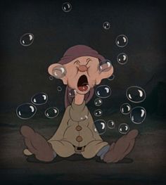 an animated character sitting on the ground with bubbles coming out of his mouth