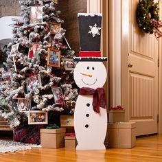 a snowman standing in front of a christmas tree with pictures on the top and bottom