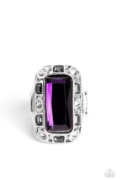 Radiant Rhinestones - Purple Rhinestone Ring - Chic Jewelry Boutique Pressed into a curved, rectangular silver frame, an oversized emerald-cut purple gem shines atop the finger. Dainty square and round gems in shades of white and smoky black airily encircle the oversized gem for some additional shimmer resulting in a radiant centerpiece. Features a stretchy band for a flexible fit. Sold as one individual ring. Order Date: 6/19/2023 Black Gems, Purple Rings, Purple Gems, Yellow Rings, Purple Rhinestone, Rhinestone Ring, Paparazzi Accessories, Blue Gems, Chic Jewelry