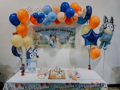 an animal themed birthday party with balloons and decorations