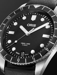 Oris' 'Divers Sixty-Five' watch family pays homage to the house's first diving timepiece that was launched the year it's named after. Featuring a black bezel with hour markers, this stainless steel reference is fitted on a leather strap and updated with an in-house Oris 400 automatic movement that's equipped with anti-magnetic technology and has a five-day power reserve. For warranty information, please refer to details & care Oris Watches, Mens Watches Leather, Latest Watches, Stainless Steel Watch, Watch Case, Black Watch, Watches Jewelry, Luxury Watches, Stainless Steel Case