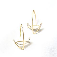 Gold & Silver Earrings - Intersecting arcs and lines create this sophisticated and simple design. The matte or oxidized sterling silver arc is contrasted by a high-polish argentium silver or 18k gold ear wire. Rubber backs provided. Modern Brass Wrap Earrings, Side Crow Pose, Side Crow, Crow Pose, Dynamic Lines, Artful Home, Argentium Silver, Lovely Earrings, Oxidized Sterling Silver