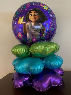 a stack of foil balloons with an image of princess pooh on them