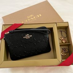 Nwt Coach Boxed Corner Zip Wristlet In Signature Embossed Leather Wallet Purse Product Details Signature Smooth Calf Leather Two Credit Card Slots Zip-Top Closure, Fabric Lining Wrist Strap Attached 6 1/4" (L) X 4" (H) X 1/2" (W) Includes Removable Charms Packaged In A Coach Gift Box With Ribbon Style No. Cf358 Rectangular Clutch With Original Box As Gift, Elegant Pouch Wallets With Original Box, Chic Black Coin Purse For Gift, Rectangular Coin Purse With Original Box As Gift, Classic Coin Purse As Gift, Compact Coach Wallet As Gift, Black Rectangular Wallet As Gift, Black Clutch With Interior Card Slots As Gift, Coach Clutch Wallets For Gifts