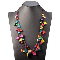 We are really happy to introduce you this Bohemia Statement Necklace & Multi Layer Beaded Wooden Long Necklace Vintage! This beautiful bohemian necklace is made of multicolor wooden squares, multicolor wooden oval beads, and a dark-colored cotton rope. Its perimeter equals 68 cm, whereas its total weight is 60 g. The images attached match exactly the quality you will get once you have it around your neck. This necklace would not only put the finishing touch to your everyday style but also could Multi Layer Necklace Beads, Colorful Statement Necklace, Layered Beaded Necklaces, Stil Boho, Ethnic Necklaces, Rice Bead, Wooden Necklace, Neck Jewellery, Summer Necklace