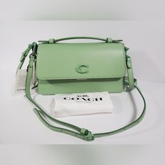 100% Authentic New With Tag And Dust Bag. This Is A Coach Retail Store Bag. Stored In Smoke-Free, Pet-Free Environment. Coach, The Monochrome Juno Crossbody Bag Features: Glovetanned Leather Color Pale Pistachio Pushlock Closure Outside Open Pocket Inside Snap Pocket Top Handle With 1" Drop Detachable Short Strap With An Approx. 13.5" Drop Detachable Long Strap With An Approx. 21.5" Drop Approx.: 2.5" W X 5" H X 9.25" L Imported Stored In Smoke-Free, Pet-Free Environment. Pocket Top, Juno, Retail Store, Coach Bags, Inside Pocket, Top Handle, Leather Bag, Crossbody Bag, Dust Bag