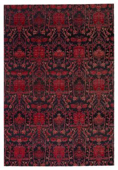 a red and black rug with an intricate design