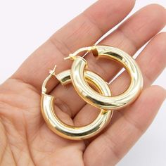 7x35mm Plain Shiny Polished Hoop Earrings 14K Yellow Gold Clad Silver 925 * Metal : Real Sterling Silver (Properly Stamped, 925) * Condition : Brand New * Finish : Polished * Average Weight : 9.09 grams * Length : 35mm = 1 3/8" * Width : 7mm = Just over 1/4" * Clasp/Bail : Hinged All of our items are brand new and are shipped with a gift box. Gold-plated Hoop Earrings With Polished Finish, Yellow Gold Stainless Steel Hoop Earrings, Polished Yellow Gold Brass Hoop Earrings, Nickel-free Yellow Gold Plated Hoop Earrings, Gold-tone Brass Hoop Earrings With Polished Finish, Fine Jewellery Earrings, Buying Jewelry, Jewelry Business, Gold Plated Silver