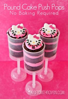 three hello kitty cupcakes sitting on top of each other with pink frosting