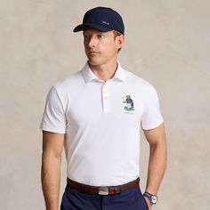 This stretch piqué Polo shirt is developed with moisture-wicking properties for enhanced comfort. At the left chest it is finished with a golf-playing Polo Bear and “RLX” logo. Moisture-wicking Polo Collar Golf T-shirt, Sporty Polo Collar Golf T-shirt, Sporty Polo Collar T-shirt For Golf, Moisture-wicking Short Sleeve Polo Shirt For Golf, Moisture-wicking Polo Collar Golf Top, Moisture-wicking Short Sleeve Golf Polo Shirt, Classic Short Sleeve Golf T-shirt, Sporty Short Sleeve Golf Polo Shirt, Classic Moisture-wicking Tops For Golf