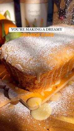 a piece of cake sitting on top of a wooden cutting board next to other food items