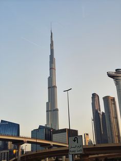 the burj tower is towering over the city