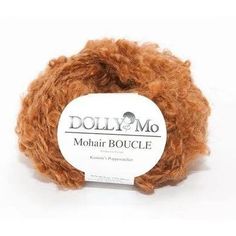 a ball of yarn with the label dolly m's mohair boucle