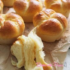 bread rolls are sitting on wax paper and ready to be eaten