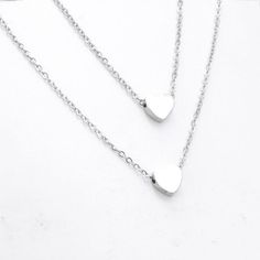 3pcs 40cm/45cm Polished Stainless steel Double Heart pendant Necklace, Personalized Heart Necklace, Love Simple Necklace, DIY Jewelry✿ QTY: 3pcs✿ Pendant Size: 3x8mm✿ Chain Length: 40cm/ 45cm✿ Chain Thickness: 1.5mm✿ Material: 316 Stainless Steel✿Color:  Silver✿ Nickel Free & Lead FreeTop Quality Triangle Necklaces, Mirror Finish, Smooth edges, Highly Polished Stainless Steel horizontal Triangle . ***These are top qualityTriangle With chains.***These come in Silver, Gold or Rose Gold.Stainle Hypoallergenic Heart Shaped Stainless Steel Necklace, Cheap Adjustable Nickel-free Heart Necklace, Hypoallergenic Heart-shaped Metal Necklace, Simple Heart Necklace, Heart-shaped Stainless Steel Keepsake Necklaces, Valentine's Day Heart-shaped Stainless Steel Necklace, Love Simple, Diy Jewelry Findings, Necklace Love