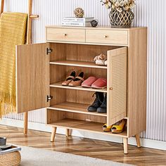 a wooden cabinet with shoes on it in a room