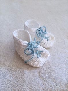 Hand Knit Baby Booties Gift - White - Baby Blue Lace Up Detail - Baby shower gift - Baby gift - Nursery decor - Newborn baby knit bootiesBecause baby boys need adorable knit booties too!These have a cool lace up front that are sure to make your little man stand out anywhere.They feature a square toe, and are bootie style.Baby can wear these with or without socks as they are made out of a gentle cotton yarn.  They can also make for a very cute keepsake.Having Boy/Girl Twins?  These have the perfe Boy Girl Twins, Knit Baby Booties, Knitted Booties, Crib Shoes, Baby Booties, Blue Lace, Boy Girl, Baby Shower Gift, Baby Gift