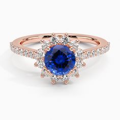 an oval blue sapphire and diamond halo ring