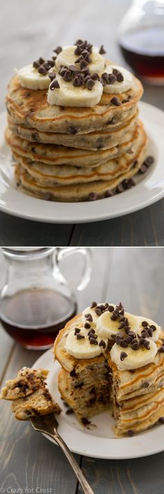 pancakes with chocolate chips and bananas on top are stacked on plates next to a cup of tea