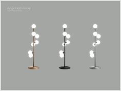 three different types of floor lamps with white balls on the top, and one is black