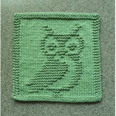 a crocheted square with an image of a cat in the center on it