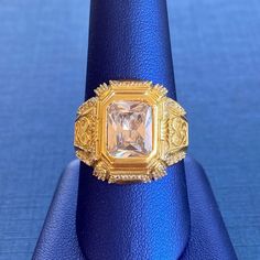 Stunning emerald cut cubic zirconia stone ring. This ring is available in 10k yellow gold. We guarantee all materials are 100% genuine as stated above. Metal: 10k Gold Stone: Cubic Zirconia Type: Ring Size: 10.5 Resizable: YES* *This ring can be resized if needed. We size up to two sizes free of charge. Please contact us for pricing on resizing more than two sizes. We need 2-3 business days to resize this ring. Thank you. Gold Octagon Diamond Ring With Center Stone, Gold Diamond Ring With Radiant Cut Gemstone, Gold Diamond Ring With Radiant Cut, Gold Emerald Cut Signet Ring With Prong Setting, Gold Octagon Cubic Zirconia Ring, Heirloom Radiant Cut Gold Jewelry, Real Gold Rings, Gold Ring Price, Gold Emerald Ring