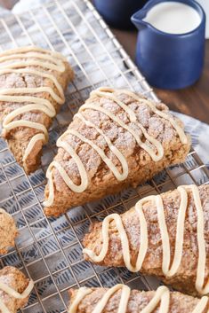 cinnamon scones with icing on a cooling rack