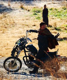 a man riding on the back of a dirt bike