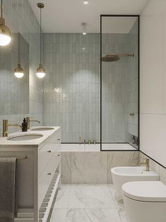 a bathroom with two sinks and a bathtub