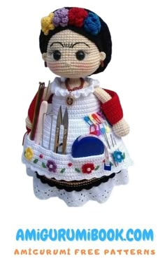 a crocheted doll is holding a knife and fork