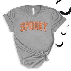 Spooky graphic in a varsity orange and white font. Perfect for this spooky season! Wear to school dress up days, Halloween parties, or just around town for halloween spirit! For All Varsity Spooky T-shirts click here to view.For Adult & Youth Varsity Spooky Sweatshirts click here to view. Adult Sizes S-XXL (unisex sizing)Youth Sizes S-XL (unisex sizing)Toddler Sizes 2T, 3T, 4T (unisex sizing) Bella + Canvas (Adult, Youth & Toddler)4.2 oz. Airlume combed and ring-spun cottonPre-shrunkFor a more relaxed fit, size up! School Dress Up Days, Dress Up Days, Camp Style, Diy Halloween Projects, School Dress, Sewing Workshop, Dress Up Day, School Dresses, Football Outfits