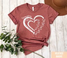 a women's t - shirt with the words grandma and two hearts on it