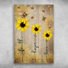 sunflowers and bees on a wooden background with the words happy fall written in cursive writing