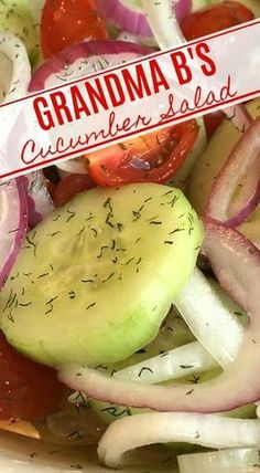 a salad with onions, cucumber and tomatoes in it is displayed on a plate