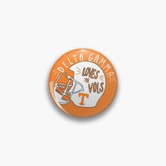 an orange and white button with the words, deltergramma ones to volls on it