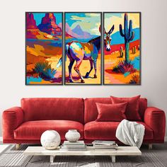 two paintings on the wall of a living room with red couches and a coffee table