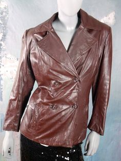 This Swedish vintage women's leather jacket is a deep oxblood brown color, and has super wide lapels. The used leather jacket closes in the front with two buttons (four in total show on the front, creating the double-breasted look). The jacket has two vertical lit hip pockets, and has a brown quilted full lining. Brand label: Jofama Size: 8 US, 10 UK (see exact measurements below) Material label: Genuine Leather Condition: Excellent ---MEASUREMENTS--- Bust = 38 inches (96cm) (the extra 2 inches Size 12 Uk, Check Dress, Brand Label, 1960s Fashion, European Vintage, Plaid Blazer, Leather Jackets Women, Vintage Summer, Vintage Yellow