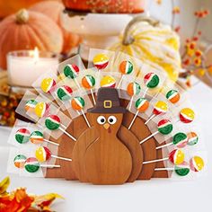 a wooden turkey with candy on it