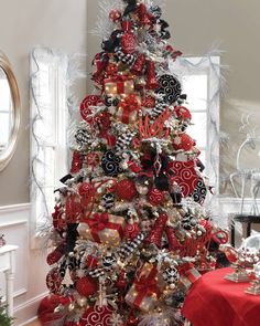 a christmas tree decorated with red and black ornaments