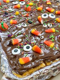 Halloween chocolate crack is a delicious and easy recipe to make for the holiday. The recipe, made with chocolate chips, brown sugar, butter, and crackers creates a toffee candy with a warm chocolate spread on top. Add your Halloween candy decor for a festive treat! Or, give the pieces away as gifts. #Halloween #chocolate #Candy #Halloweencandy #ideas #treats #homemade #bark #candycorn #best #dessert #holidaydessert #easy #simple #ad #sponsoredpost @Wiltoncakedecorating Homemade Bark, Cracker Toffee Recipe, Saltine Cracker Candy, Saltine Cracker Toffee, Saltine Cracker, Easy Treats To Make, Brown Sugar Butter, Cracker Candy, Candy Decor