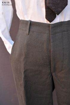 Made in highest quality Belgian linen. The fabric is pre-stone washed for a texture look. I consider this a year round fabric. The color is in a rich olive color almost like a woolen fabric color. Based on 1910s work pant with notch back waist, suspender buttons, adjustable back buckle, button fly and red tape inside outseam. Corozo buttons. Size 30: waist 32 1/2" Size 32: waist 35" (This particular size fits more like a size 33) Size 34: waist 36 1/2" Size 36: waist 38" Made in New York. Olive Fitted Straight Leg Bottoms, Fitted Straight Leg Olive Bottoms, Fitted Olive Straight Leg Bottoms, Tailored Linen Pants With Pockets, Classic Linen Pants With Pockets, Olive Linen Bottoms With Pockets, Formal Solid Linen Pants, Classic Flax Trousers, Fitted Vintage Linen Bottoms