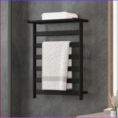 a towel rack with two white towels hanging on it