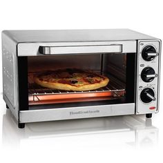 a silver toaster oven with a pizza in it