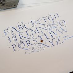 the letters and numbers are drawn with blue ink