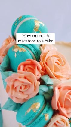 a close up of a cake with frosting and flowers on it that says how to attach macarons to a cake