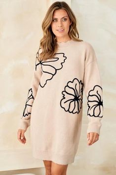 This whimsical sweater dress is an ode to simpler times. Delicate floral embroidery and scalloped accents evoke memories of carefree afternoons in a sun-dappled meadow. At the same time, its cozy knit fabric and effortless pullover silhouette keep you grounded in the present. Destined to become your go-to piece for lazy weekends and casual gatherings with friends, this lightweight wonder transitions gracefully. Whether you pair it with sneakers for a retro-inspired look or heeled booties for nig Beige Crew Neck Dress For Spring, Beige Crew Neck Spring Dress, Beige Crew Neck Sweater Dress For Spring, Beige Floral Embroidery Sweater For Spring, Spring Long Sleeve Soft Knit Sweater Dress, Spring Beige Sweater With Floral Embroidery, Soft Knit Long Sleeve Sweater Dress For Spring, Oversized Beige Sweater Dress For Spring, Spring Soft Knit Long Sleeve Sweater Dress