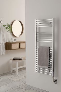 a bathroom with a towel rack and mirror